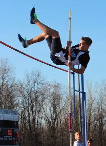 Sophomore Anthony Eaton pole-vaults during a track meet on Wednesday, April 24. Eaton started pole vaulting because he saw it his freshman year and thought it looked fun. “[When I am pole-vaulting, I think] to work on my speed and fine technique that I need to use,” Eaton said.