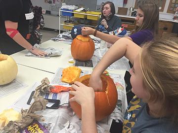 Artists carve pumpkins
