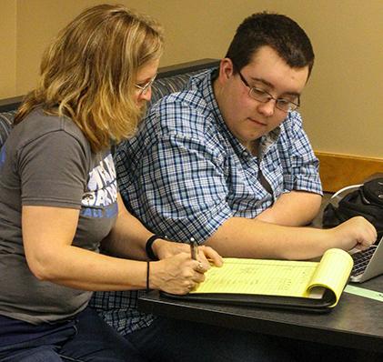 Senior Patrick Jorgenson is getting help from science teacher Nequelle DeFord during after school tutoring. 