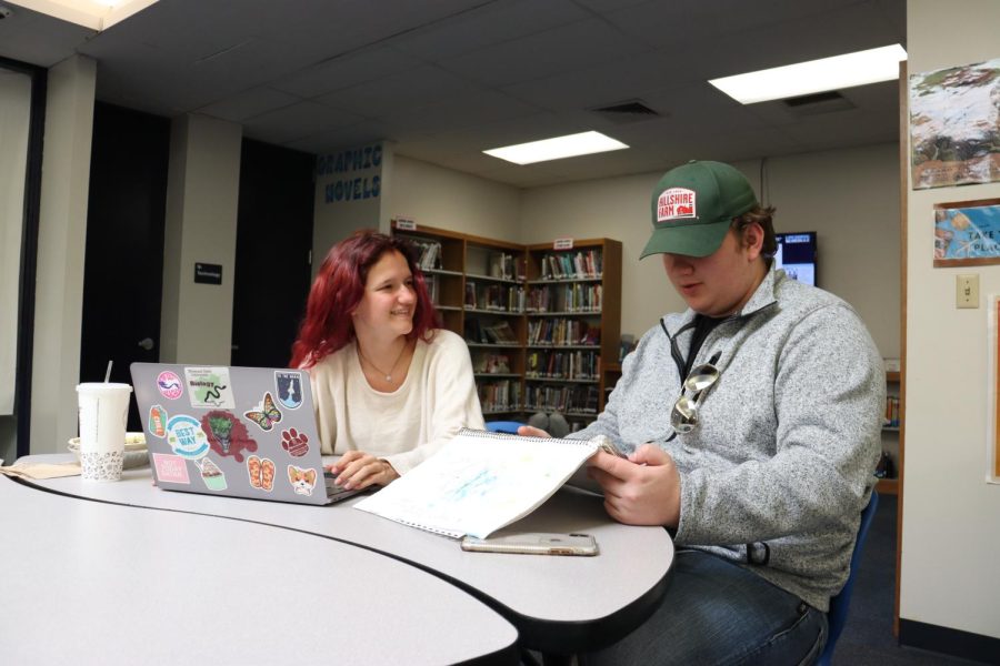 Seniors Alexandria Pierce and Lane Mills studying together in the library. They both bought books off of Amazon for the ACT/SAT. “I did like 10 to 15 questions, like, per night on a different subject,” said Pierce. She said buying the book was worth it. “Dont sweat the small stuff, overthinking it is where you make the most mistakes,” said Mills. 
