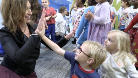 Rochel Daniels, EdD., high fives students. She will be the next superintendent of NKC Schools. 