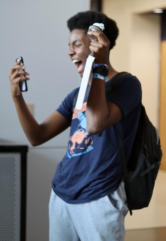 On the phone with his mom, junior Olin Spencer shares the good news.