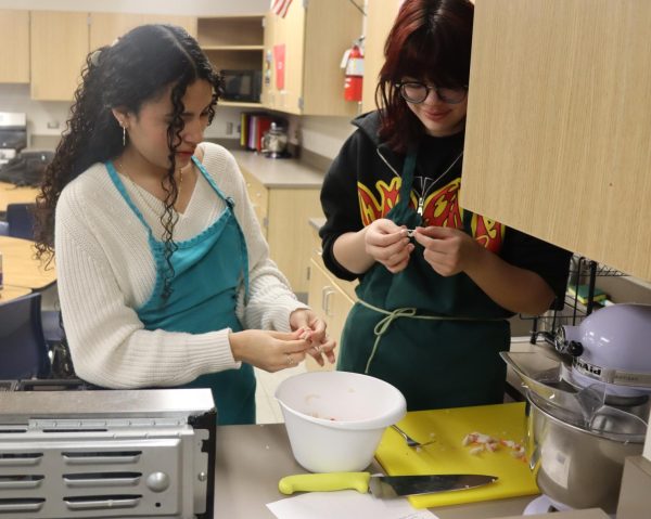 Kimmy Ferman and Star Granado rip crab to make crab rangoons. 