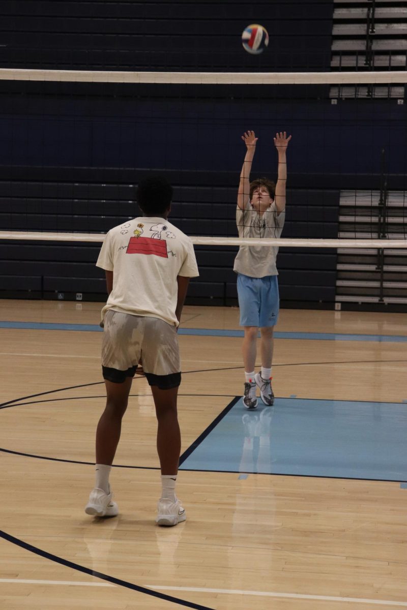 Here there practicing getting the ball over the net for simple back and forth hits. And they were setting up sets for spikers. Witch spike the ball over the net for a killer finish. “I was trying to hit the ball high here so the spikers could get it over” Gage Eichen freshman