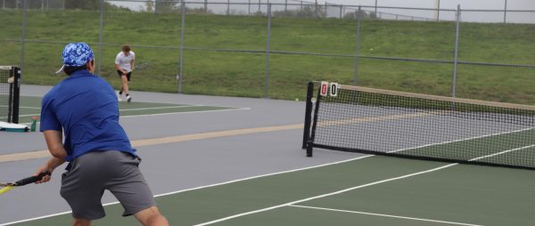 Sophomore Alex Grider follows through with his racquet. Grider is a part of the Top 6 on the Oak Park tennis team this year, and continues to improve his skills. This was the beginning of his match against Staley.
