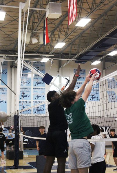 Sophomore Holden Shields and Lennox Dotson guarding a spike during practice. Holden says "I wish I had jumped sooner to stop the ball better, but it was a good block anyways."