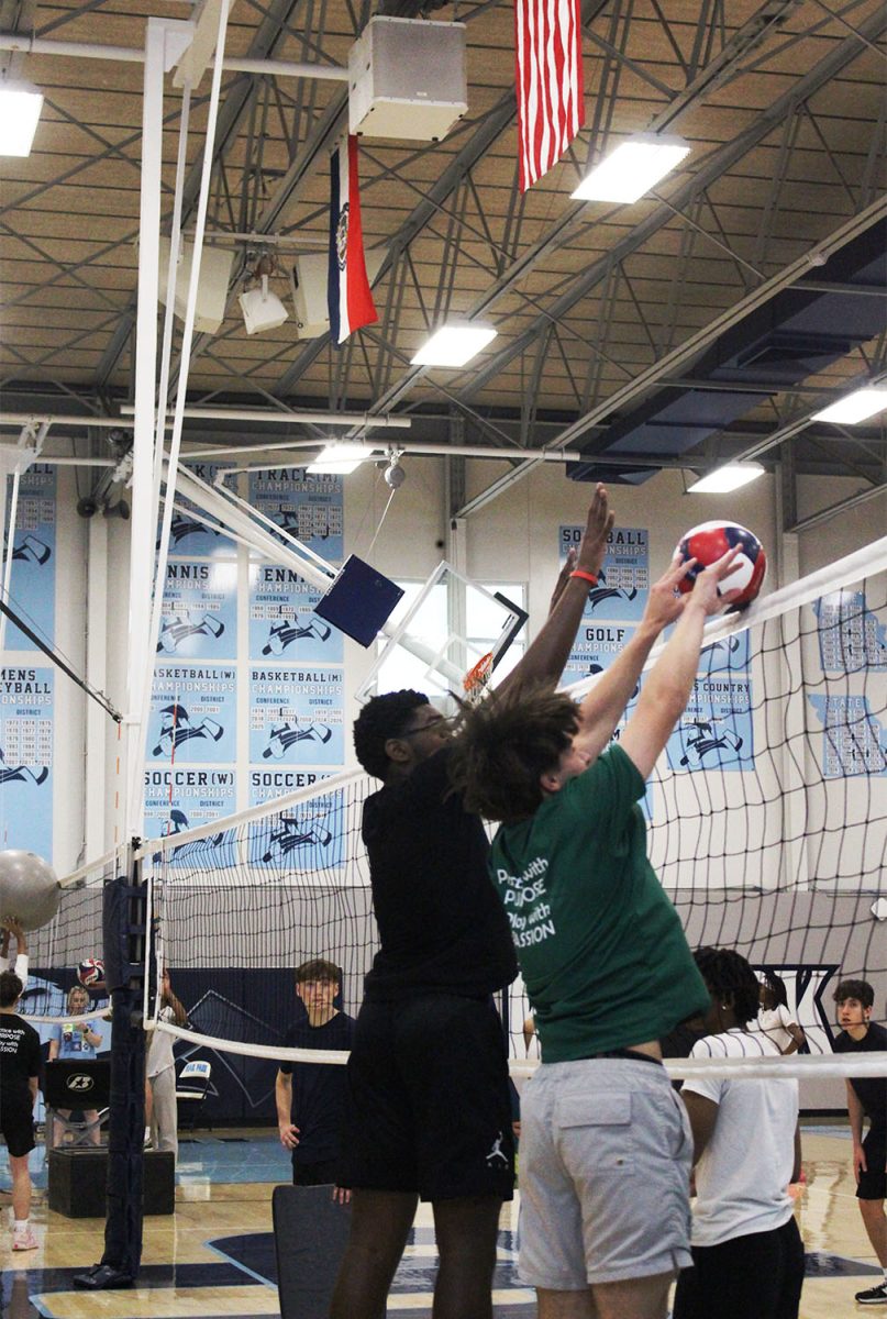 Sophomore Holden Shields and Lennox Dotson guarding a spike during practice. Holden says "I wish I had jumped sooner to stop the ball better, but it was a good block anyways."
